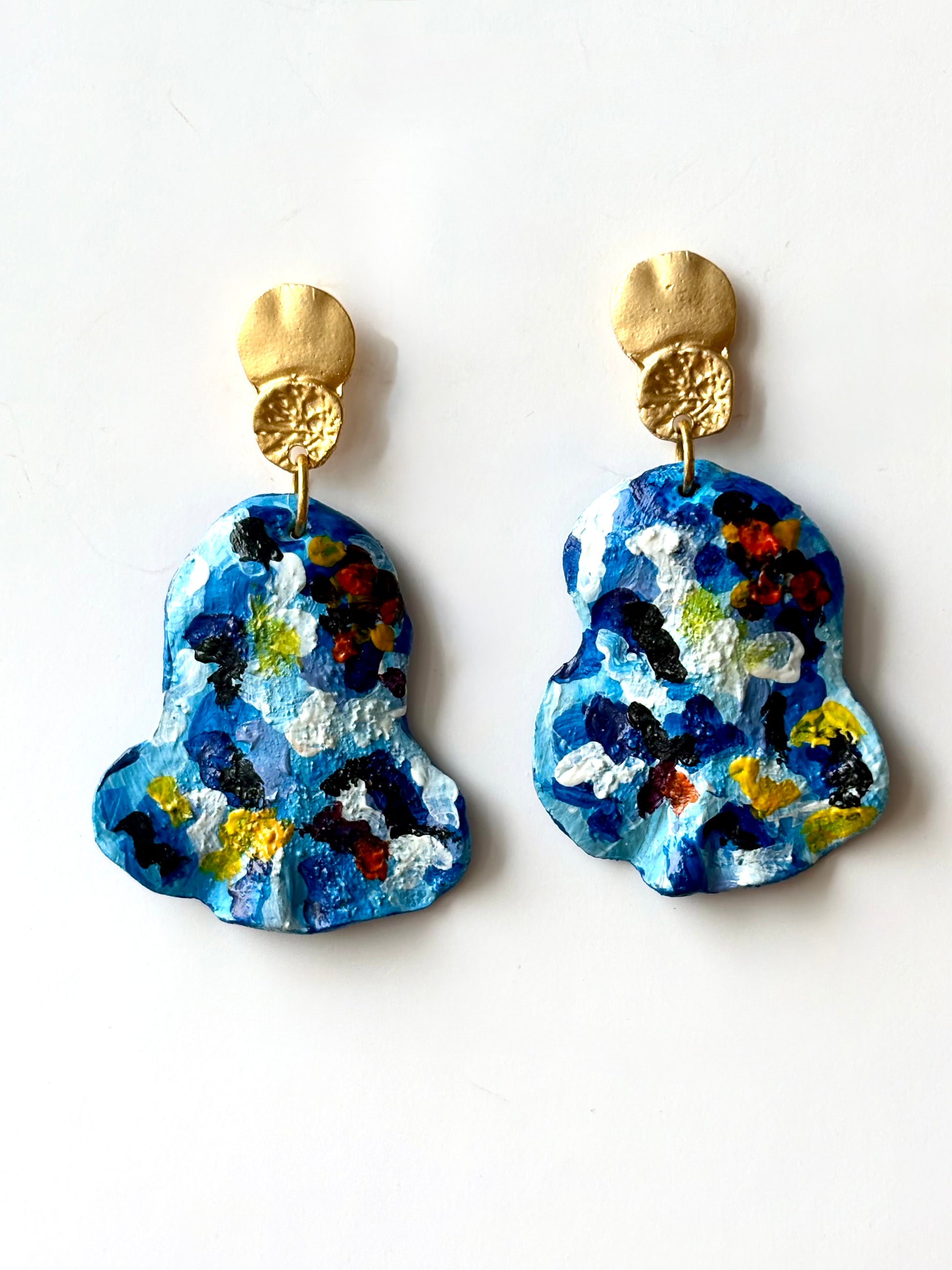 Handmade and hand-painted blue mosaic drop earrings with gold metallic tops on a white background