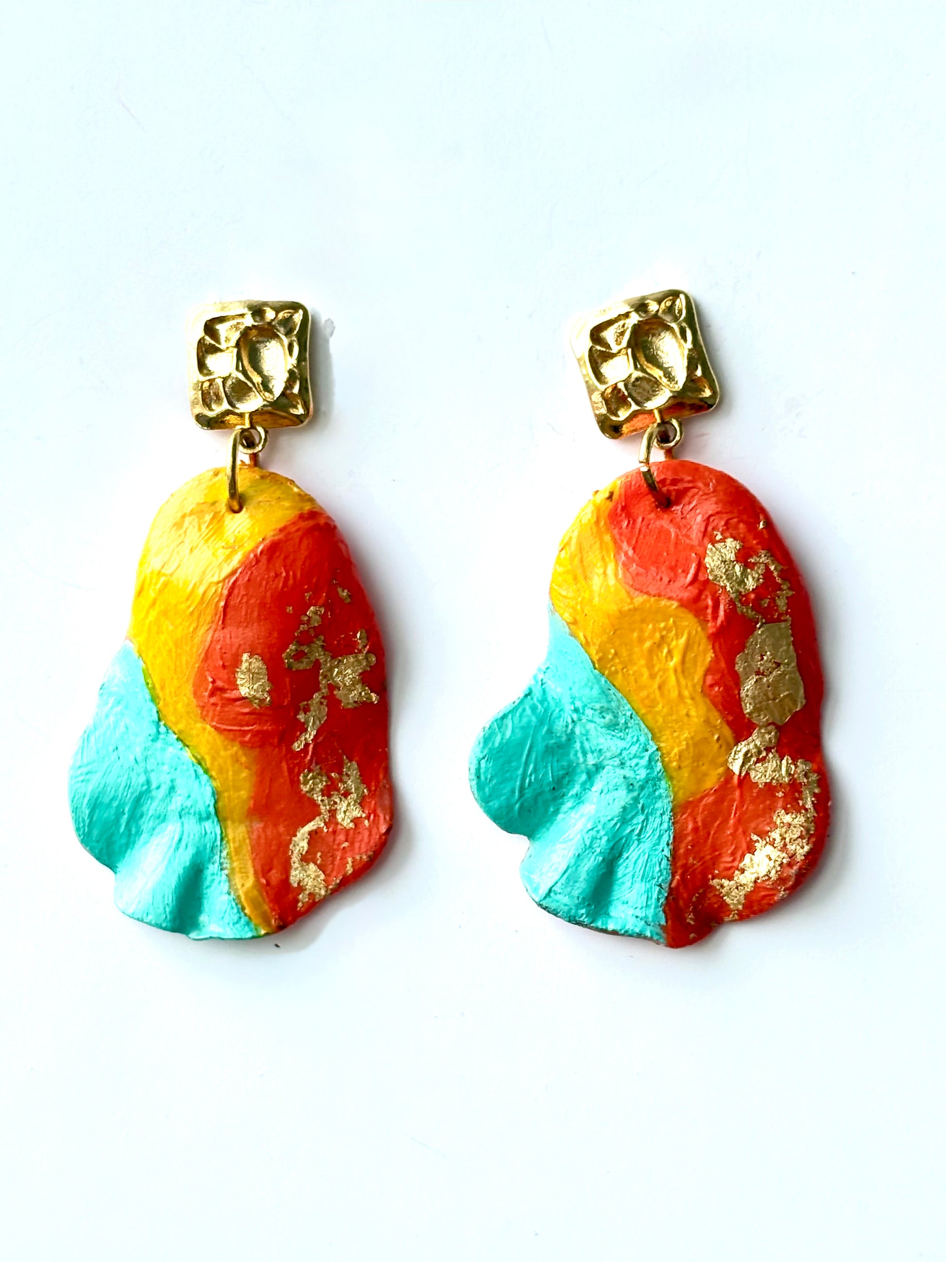 Handmade and hand-painted turquoise, yellow, and coral drop earrings with gold leaf details designed in Brussels by Ozlem Cali
